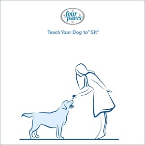 girl holding treat above dog 
